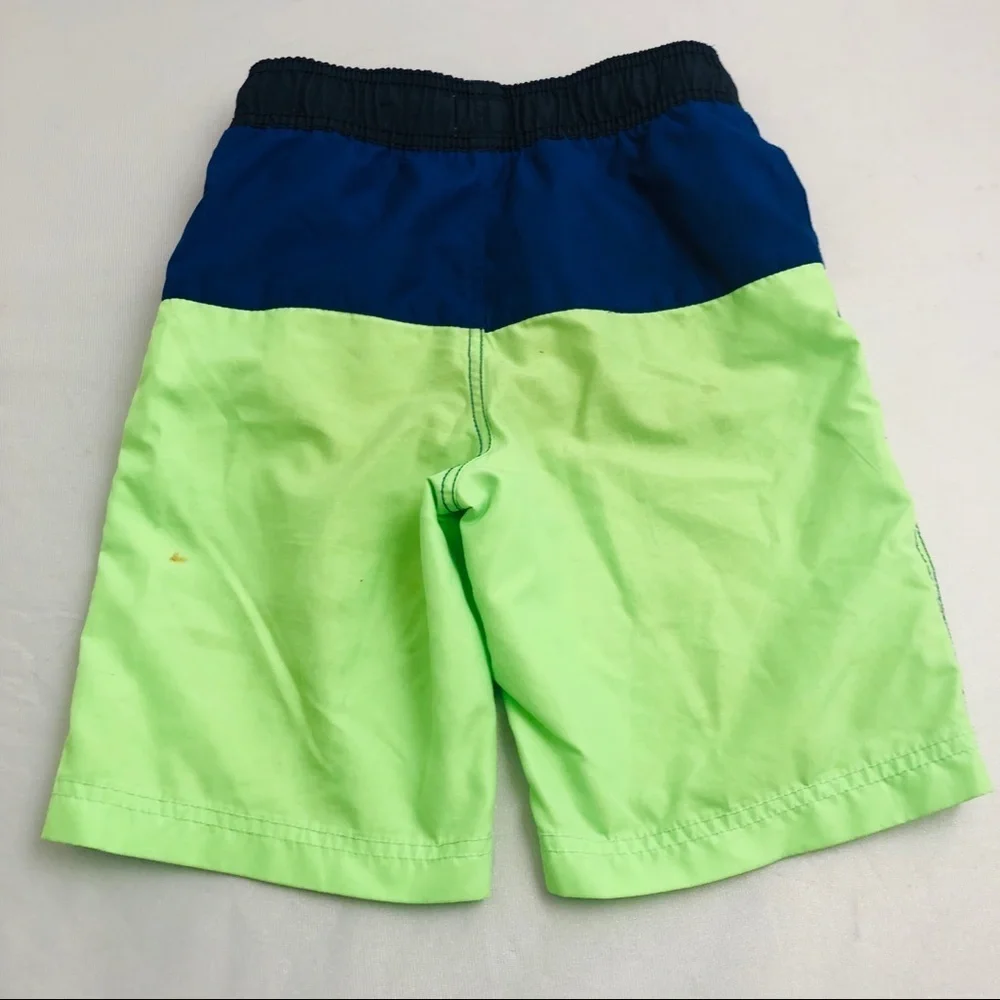 The Children’s Place blue and neon green swim trunks